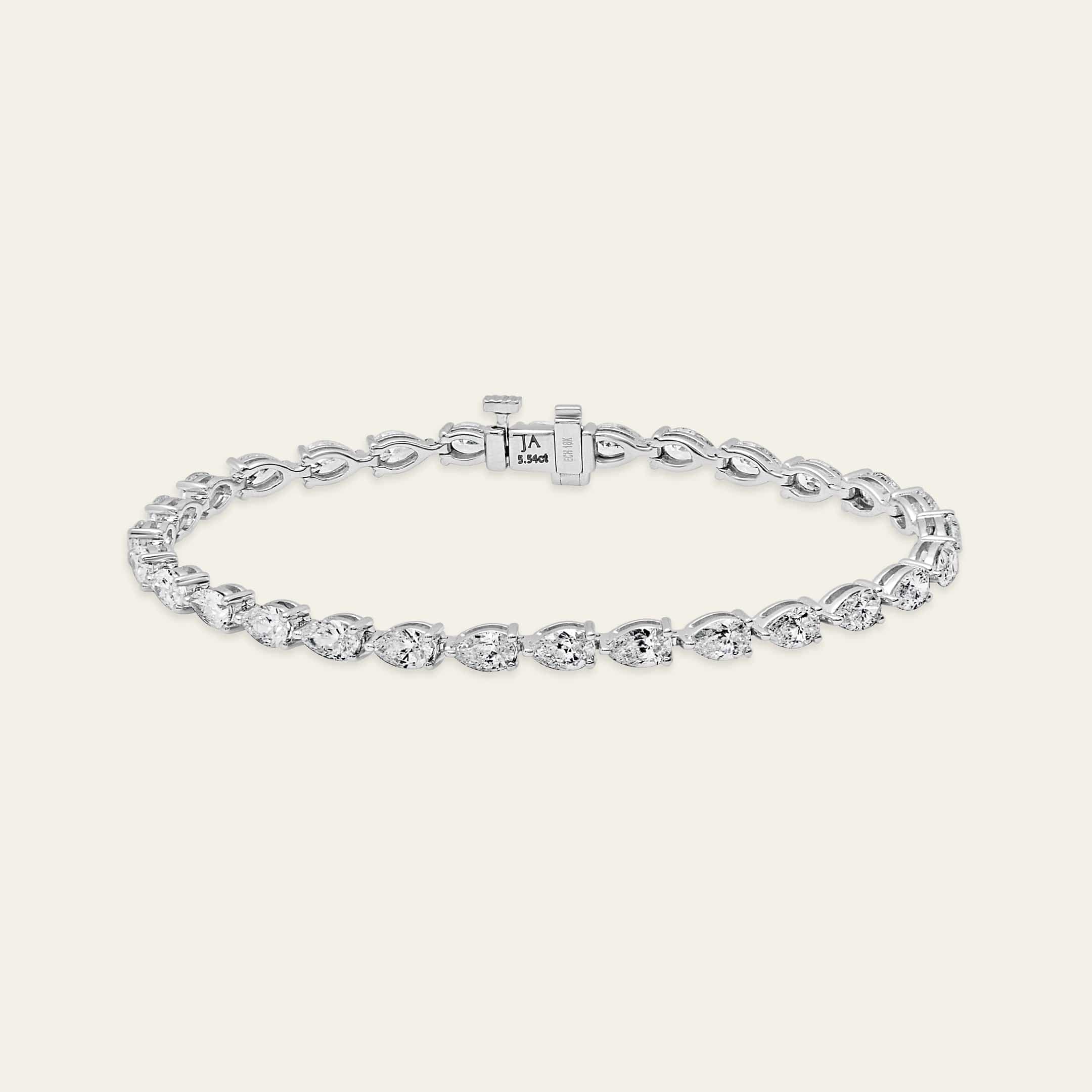 esme-6-carat-pear-shaped-diamond-tennis-bracelet-jewels-aficionado-1146587239.jpg