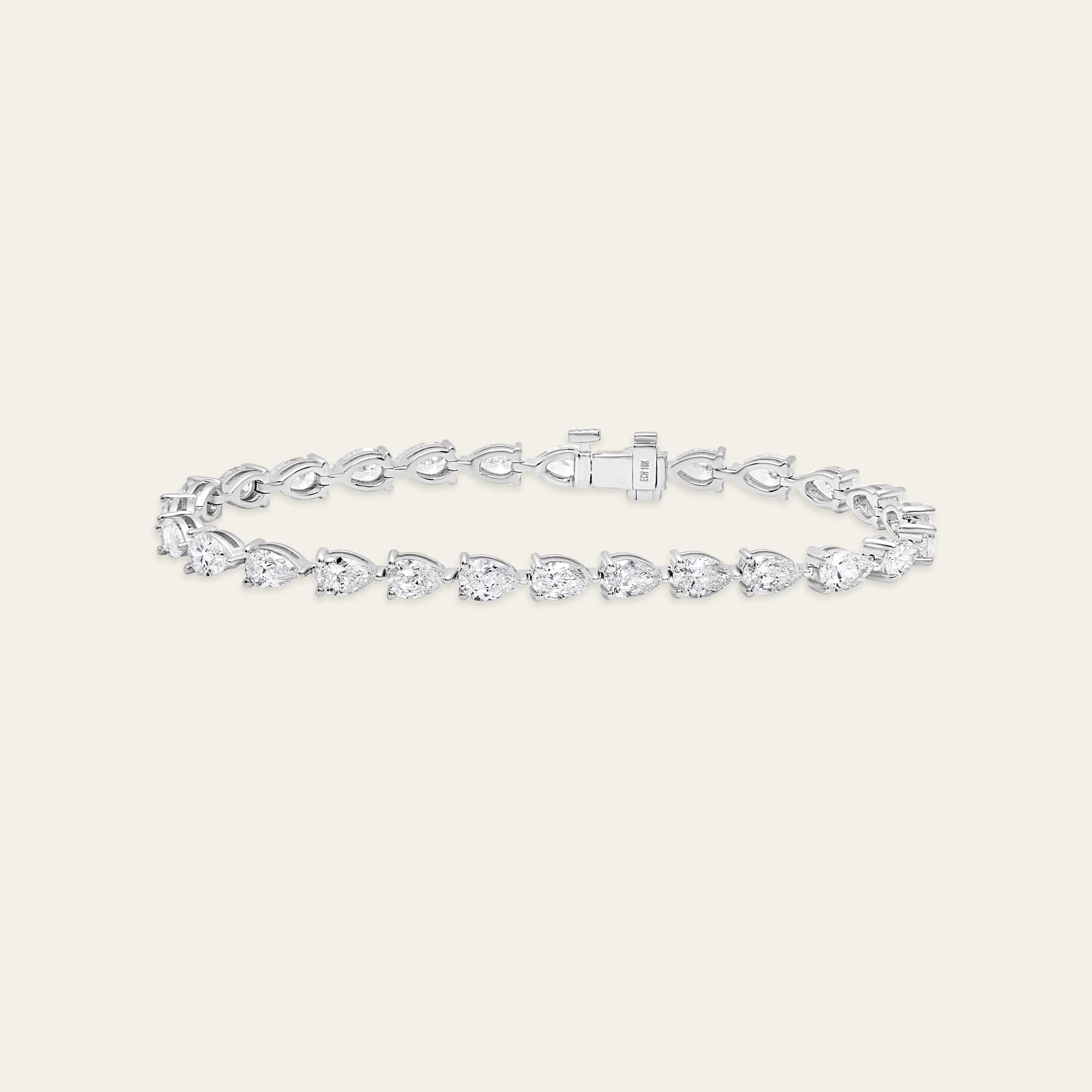 esme-7-carat-pear-shaped-diamond-tennis-bracelet-jewels-aficionado-1146587246.jpg