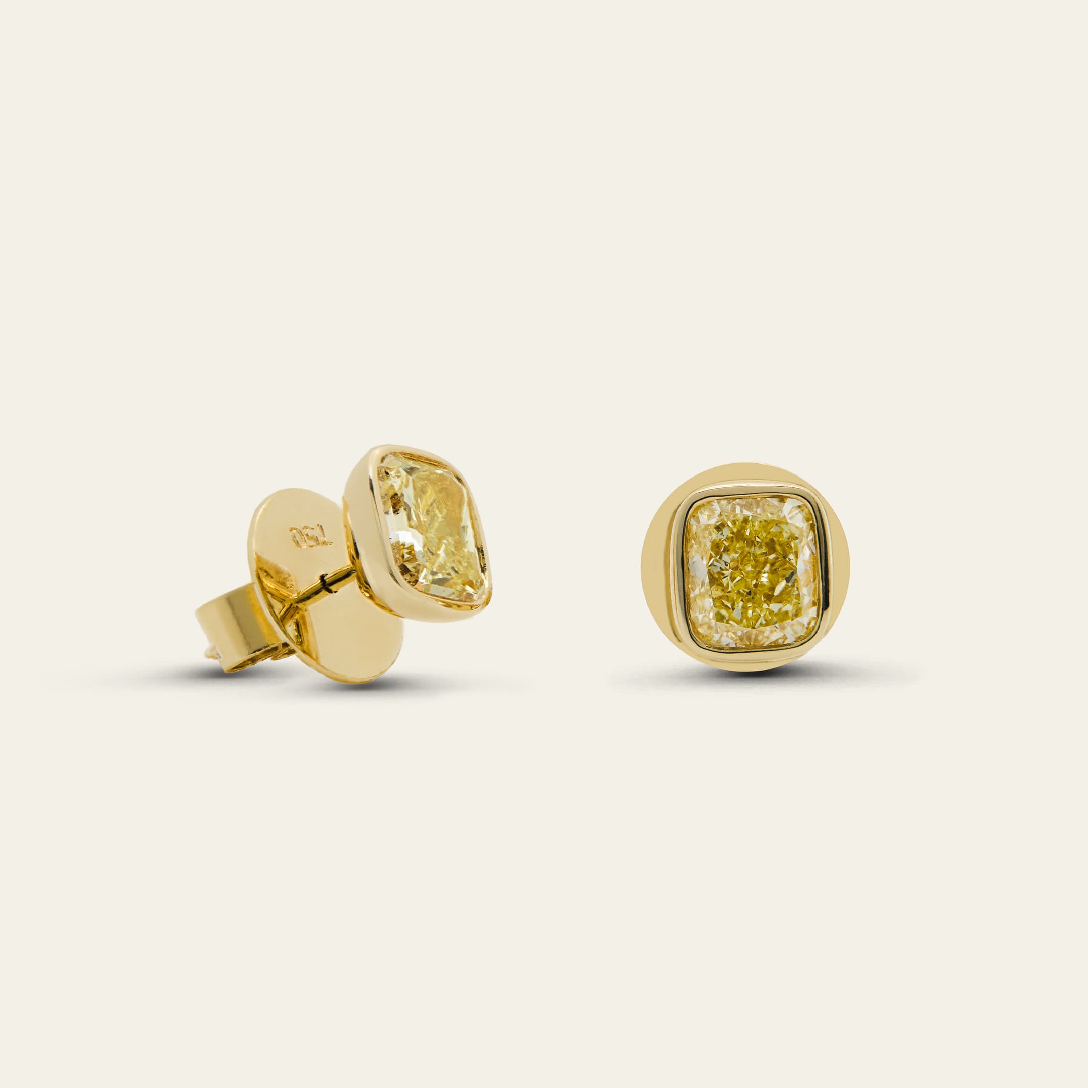 4.03 Carat Cushion Cut Fancy Yellow Diamond Bezel Set Stud Earrings