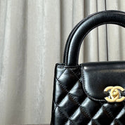 Chanel Nano Kelly Shopper Black Shiny Aged Quilted Calfskin Brushed Gold Hardware