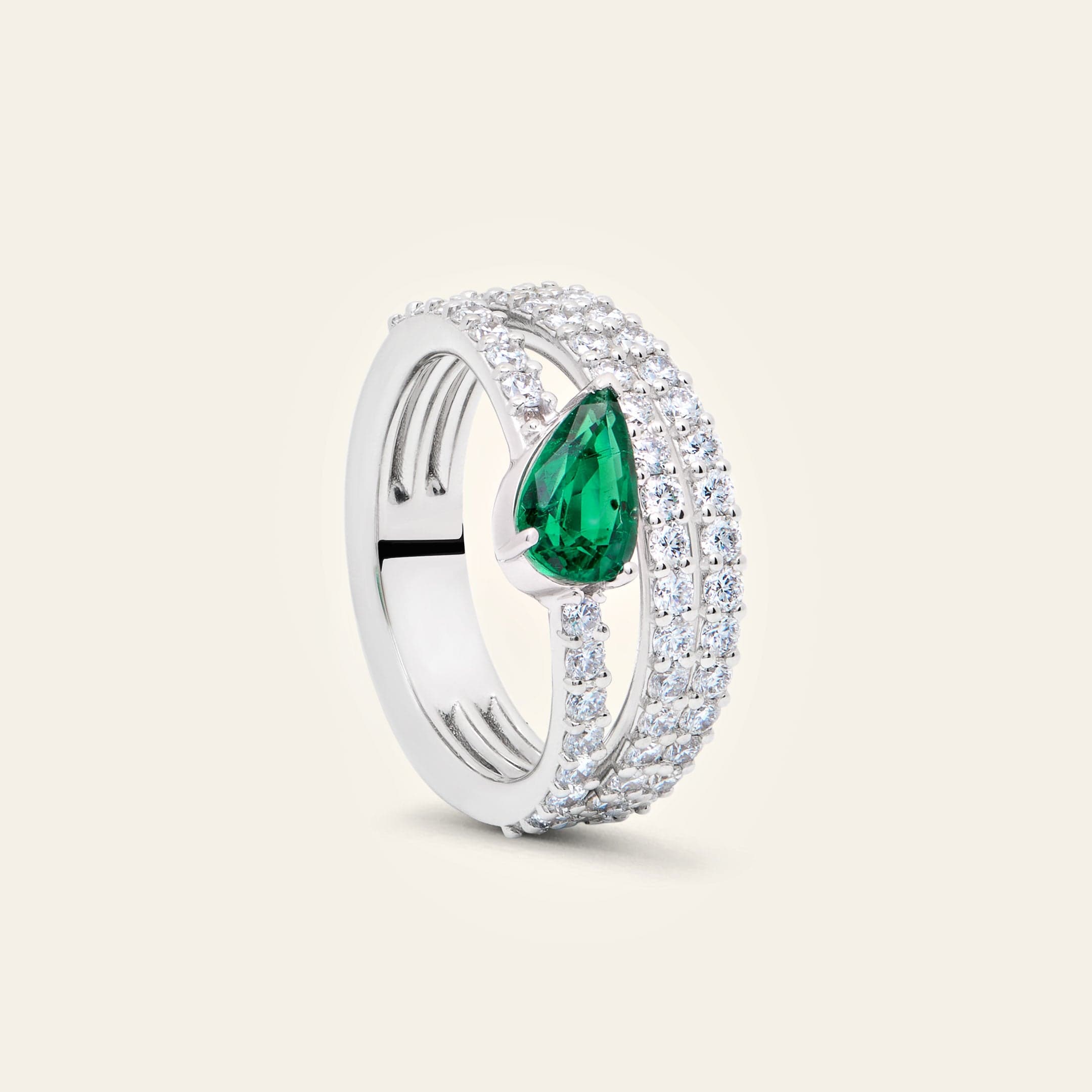 diamond-ring-with-pear-shaped-emerald-accent-jewels-aficionado-1211424499.jpg