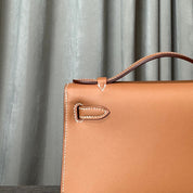 Hermès Gold Kelly Pochette Clutch Swift Gold Hardware