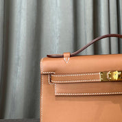 Hermès Gold Kelly Pochette Clutch Swift Gold Hardware