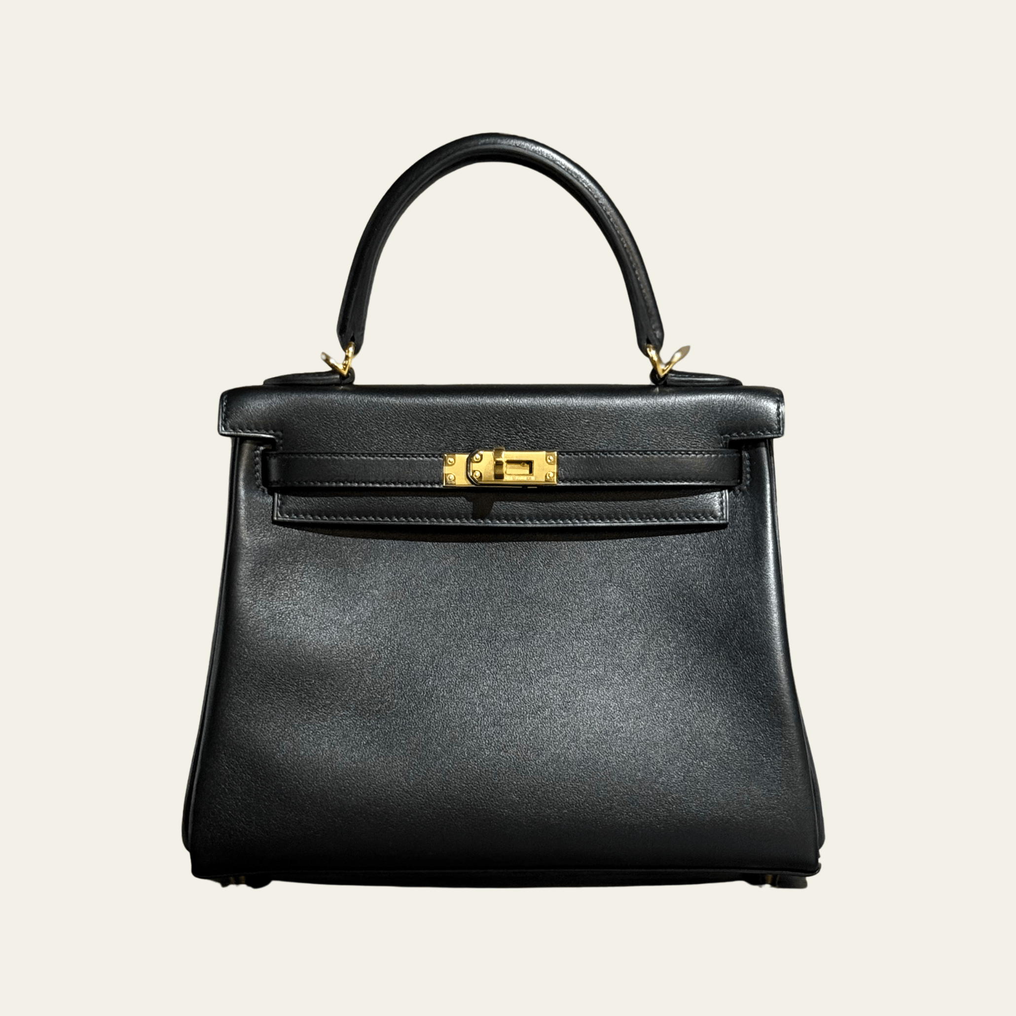 hermes-noir-kelly-retourne-25-swift-gold-hardware-hermes-1200629009.png