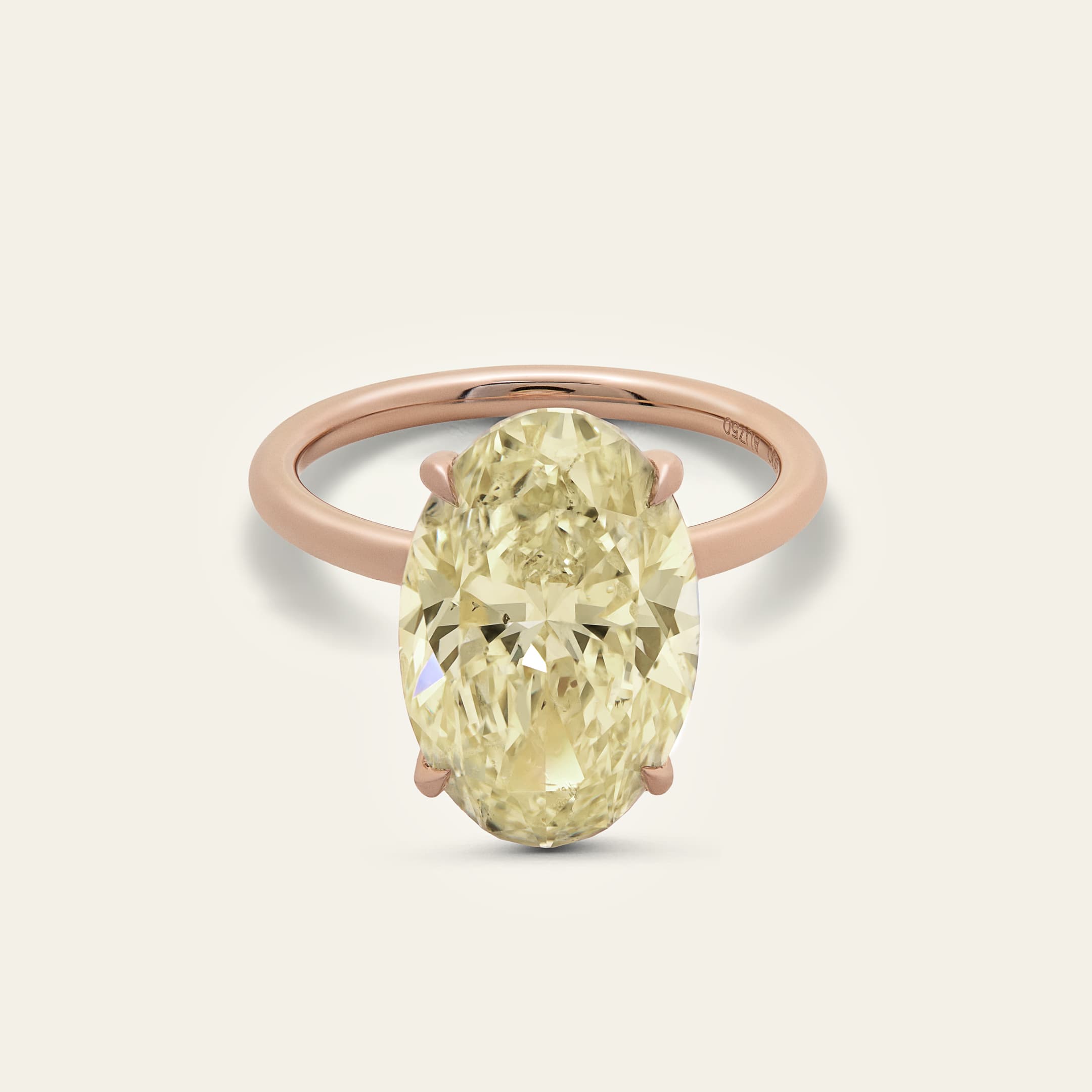 oval-diamond-engagement-ring-in-rose-gold-jewels-aficionado-1237097955.jpg