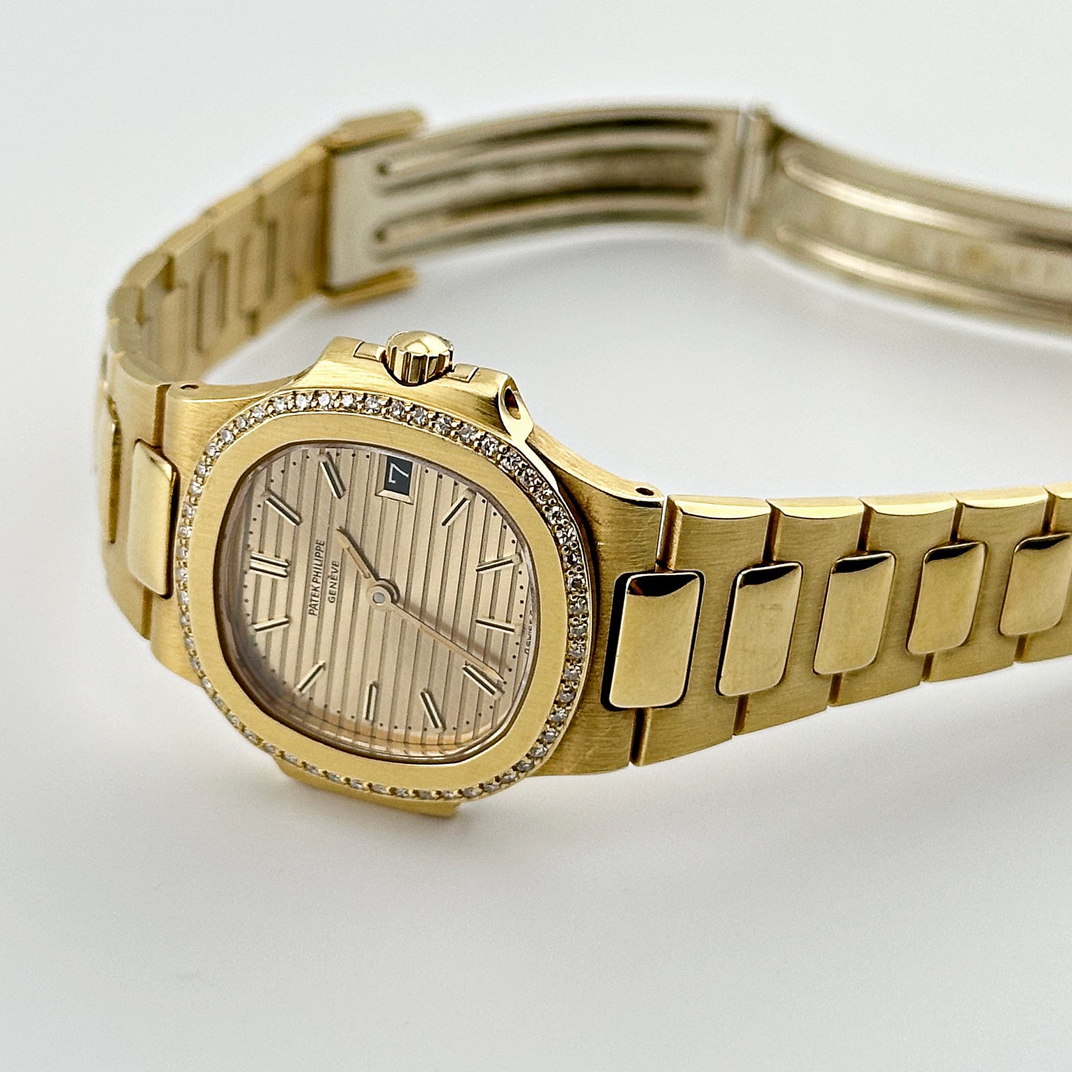 Patek Philippe Nautilus 4700/1J Yellow Gold Champagne Dial Diamond Bezel