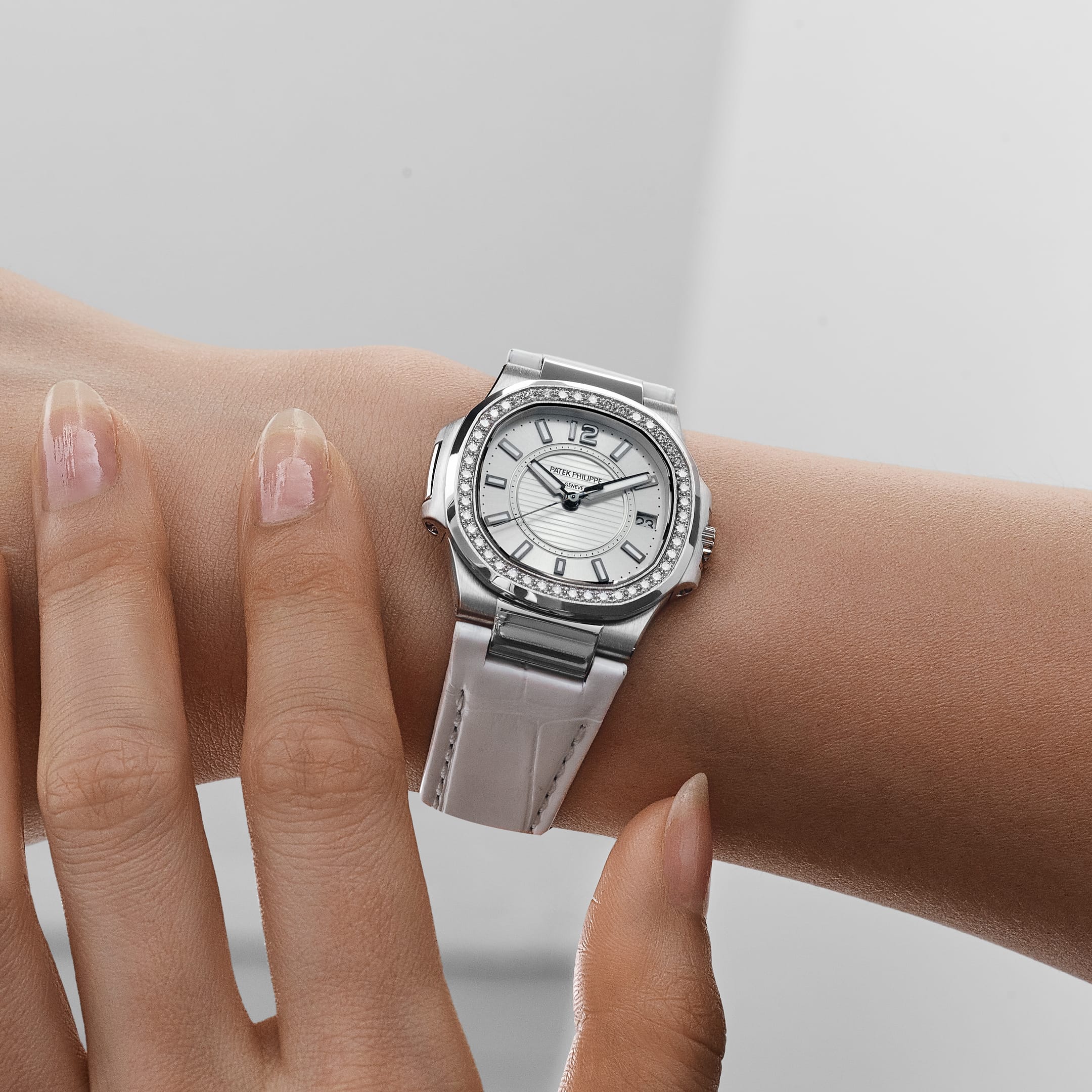 Patek Philippe Nautilus 7010G 'Ladies' White Gold Silver Dial Diamond Bezel Quartz