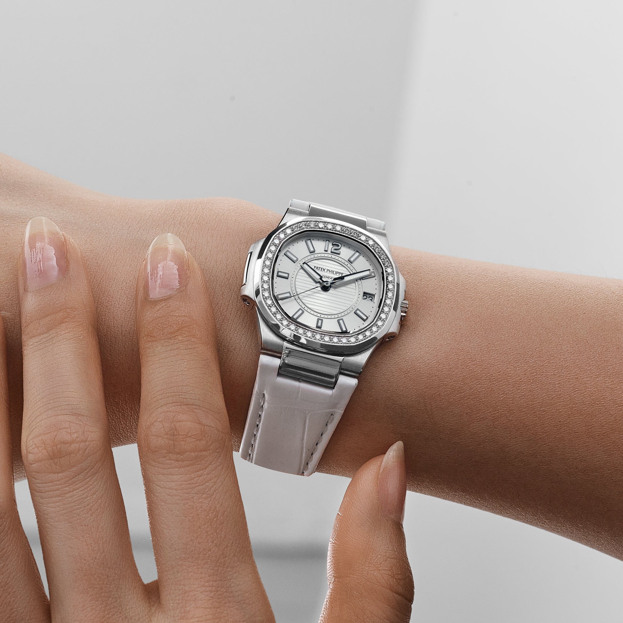 Patek Philippe Nautilus 7010G 'Ladies' White Gold Silver Dial Diamond Bezel Quartz