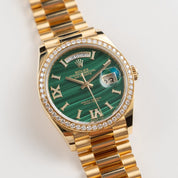 Rolex Day-Date 36 128348RBR Yellow Gold Green Malachite Dial Diamond Bezel (2021)