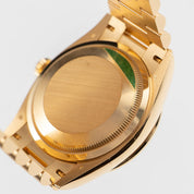 Rolex Day-Date 36 128348RBR Yellow Gold Green Malachite Dial Diamond Bezel (2021)