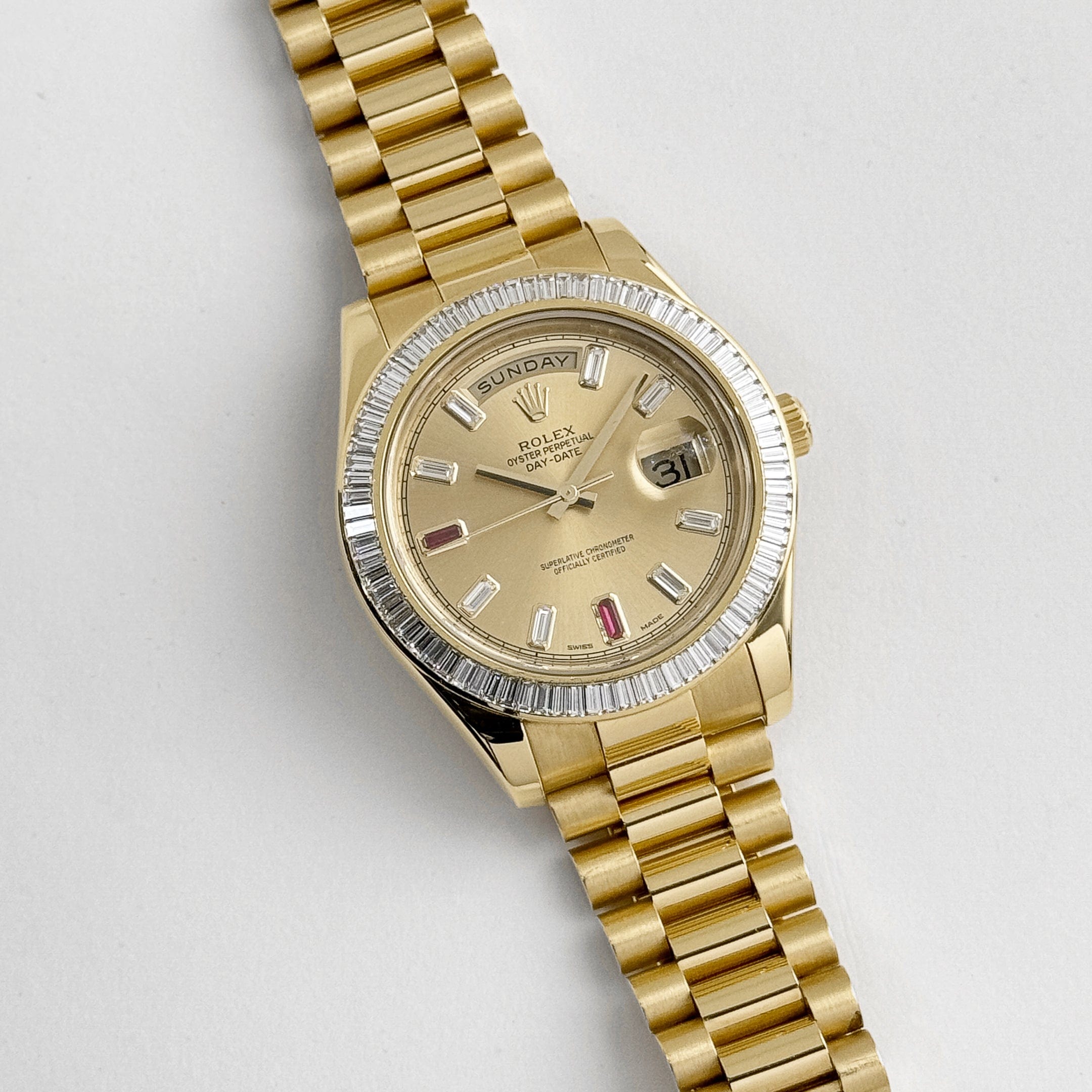 Rolex Day-Date II 218398 Yellow Gold Champagne Ruby Dial Diamond Bezel (2010)