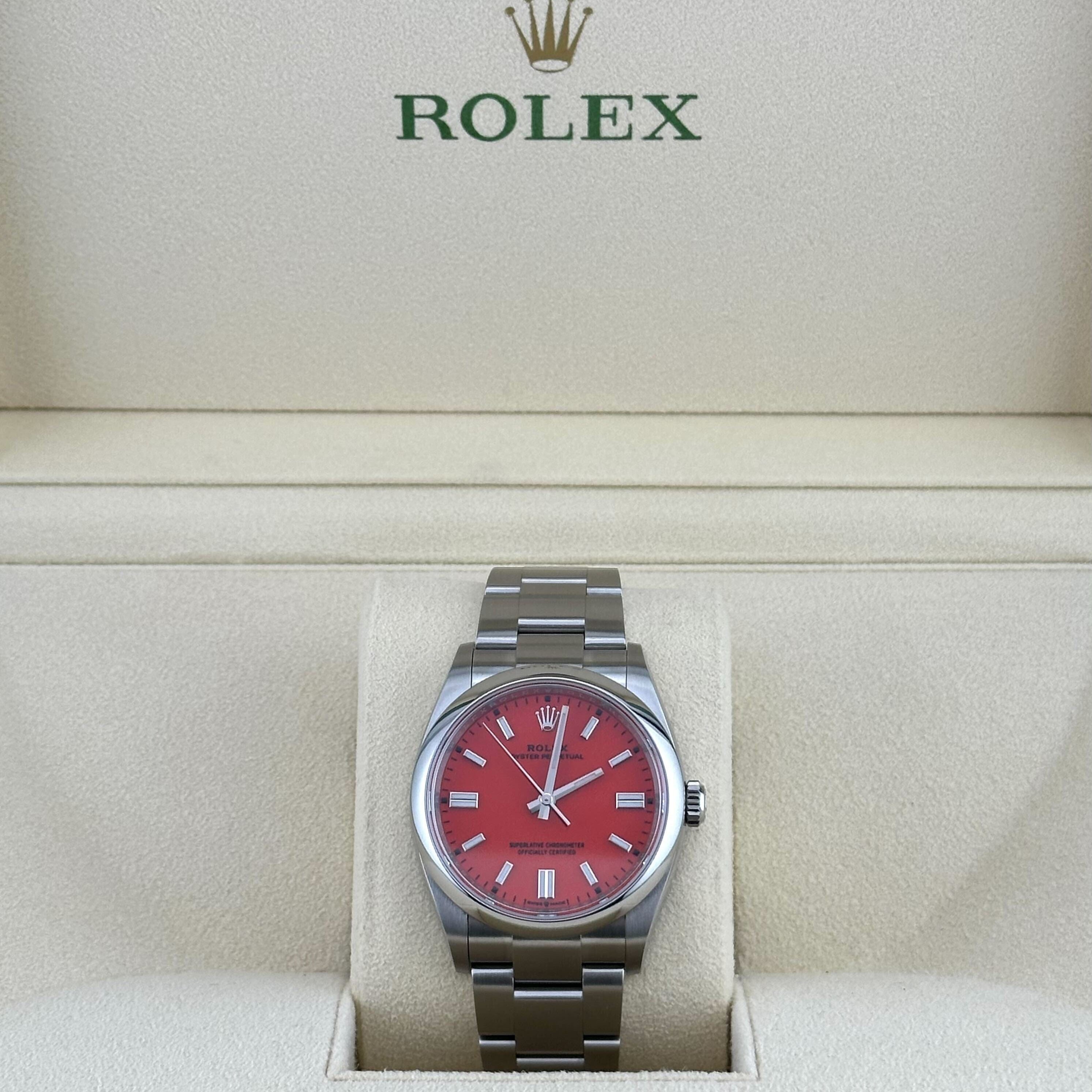 Rolex Oyster Perpetual 126000 Stainless Steel Coral Red Dial